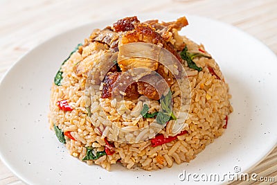 fried rice with Thai basil and crispy belly pork Stock Photo
