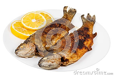 Fried river trout fish on plate Stock Photo