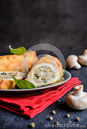 Fried rolls coated in batter and stuffed with mushroom, cheese, onion and parsley Stock Photo