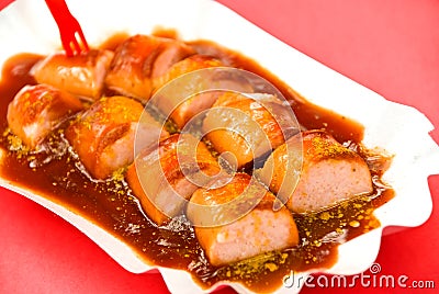 Fried sausage ,curry,with ketchup Stock Photo