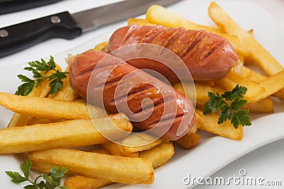 Fried sausage with french fries Stock Photo