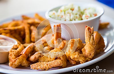 Fried Shrimp with Fries and Coleslaw Stock Photo