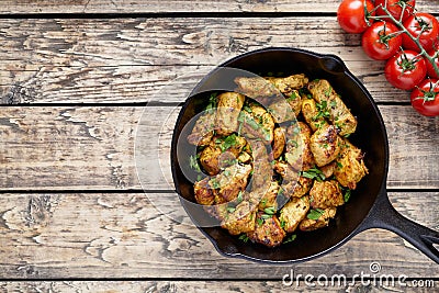 Fried sliced chicken or turkey fillet meat with chopped parsley Stock Photo