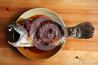 Fried snapper fish with hot chili sauce Stock Photo