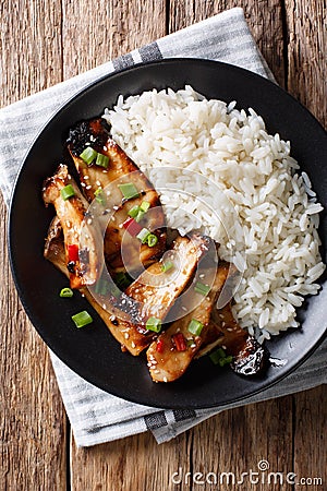 Fried spicy King Brown Mushroom with rice close-up on a plate. V Stock Photo