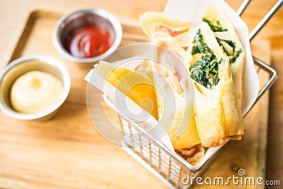 Fried spring roll with ham cheese and spinach vegetable Stock Photo