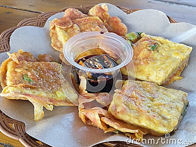 Fried tempeh or mendoan with soy sauce Stock Photo