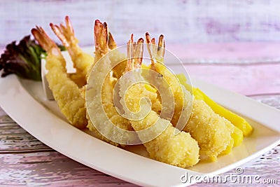 Fried TEMPURA PRAWNS served in dish isolated on table closeup top view of grilled seafood Stock Photo
