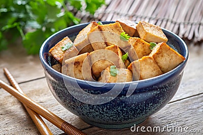 Fried tofu in bowl, Vegetarian food Stock Photo