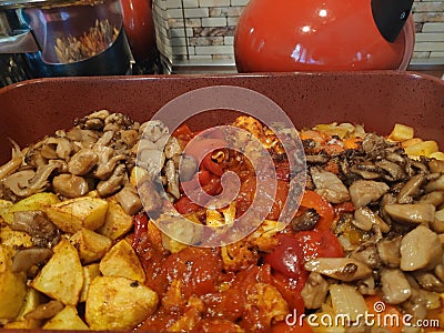 Fried vegetables - mushrooms, potatoes, zucchini Stock Photo