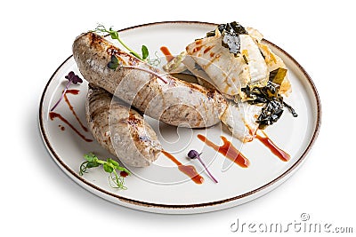 Fried Weisswurst white veal sausage with marinated cabbage and sea wed Stock Photo