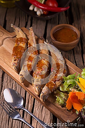 Fried Whisker sheat fish with chili sauce Stock Photo