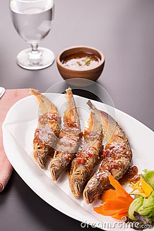 Fried Whisker sheat fish with chili sauce Stock Photo