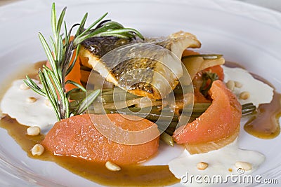 Fried zander with stewed tomatoes Stock Photo