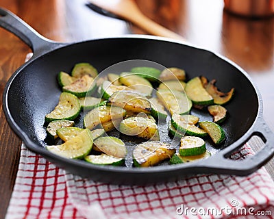 Fried zucchini, in iron skillet Stock Photo
