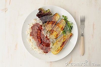 Fried zucchini with rice and sause Stock Photo