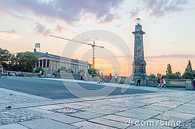 Friedrichs Brucke bridge with undefined people at sunset. Editorial Stock Photo