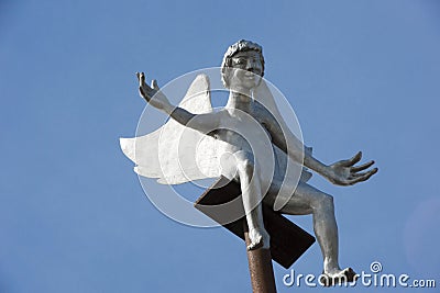 Friendly Angel sitting on pole on mountaintop Editorial Stock Photo