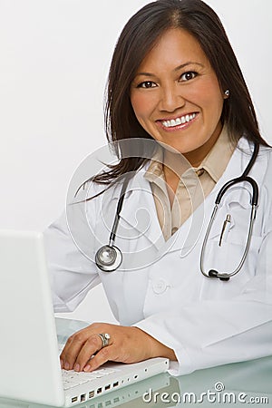 Friendly Asian doctor smiling. Stock Photo