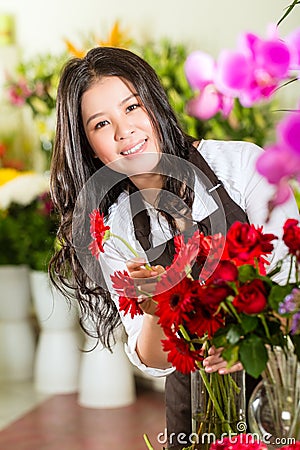 Chinese Saleswoman in a flower shop Stock Photo