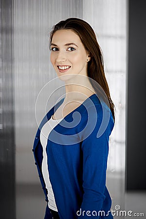 Friendly asian student girl standing straight. Business headshot or portrait in office Stock Photo