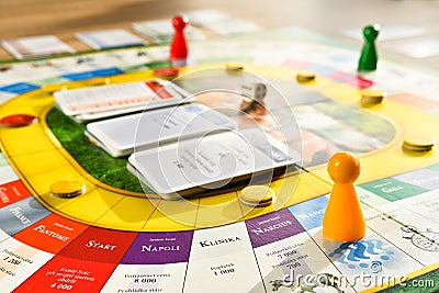 A friendly board game spread out on a table in the room. Gameplay in progress Editorial Stock Photo