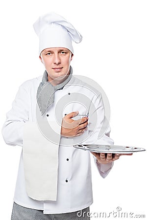 Friendly chef with a tray on his hand posing on a white Stock Photo