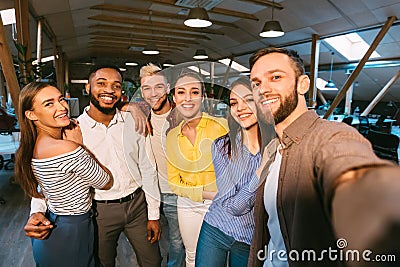 Friendly colleagues taking selfie at coffee break Stock Photo
