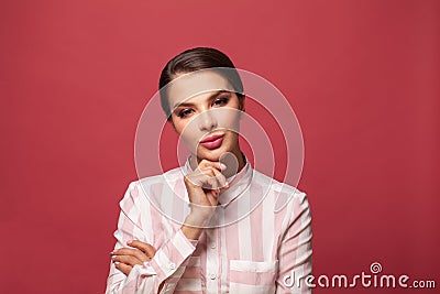 Friendly confident young woman over red background Stock Photo