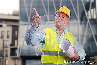 Friendly contractor holding sketches pointing index finger Stock Photo