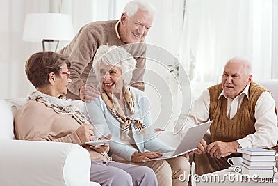 Friendly conversation of elderly neighbors Stock Photo