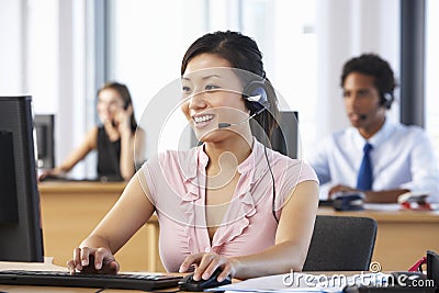 Friendly Customer Service Agent In Call Centre Stock Photo