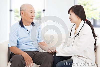 Friendly doctor caring senior man indoor room Stock Photo