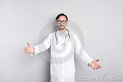 Friendly doctor making an inviting gesture Stock Photo