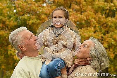 Friendly family in autumn park Stock Photo