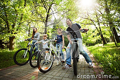 Friendly family is on a picnic. Biking. Stock Photo
