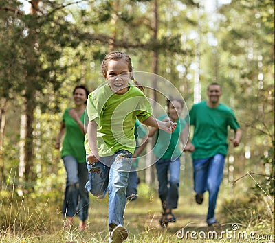 Friendly family running Stock Photo