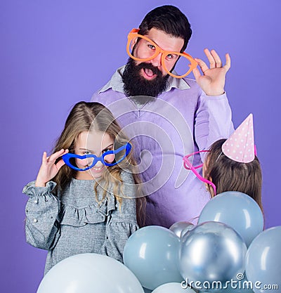 Friendly family wear funny party accessories. Fathers day. Daughters need father actively interested in life. Single Stock Photo