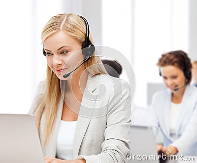 Friendly female helpline operator Stock Photo