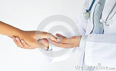 Friendly female medicine doctor hands holding woman patient hand for encouragement and empathy partnership trust and medical Stock Photo