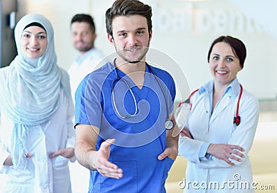 Friendly male doctor with open hand ready for hugging Stock Photo