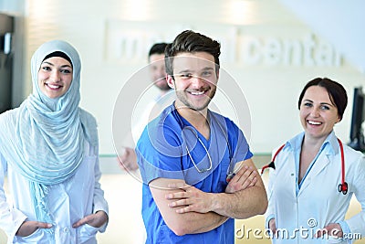 Friendly male doctor with open hand ready for hugging Stock Photo