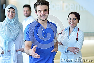 Friendly male doctor with open hand ready for hugging Stock Photo