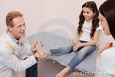 Friendly prominent specialist giving a positive prognosis Stock Photo