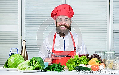 Friendly service. Happy bearded man. chef recipe. Vegetarian salad with fresh vegetables. Dieting organic food. Healthy Stock Photo