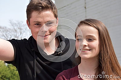 Friendly siblings, both with many freckles Stock Photo