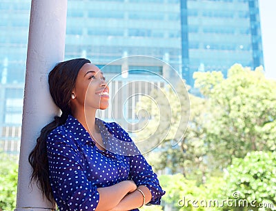 Friendly smiling business woman outside office building Stock Photo