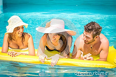 Friends on airbed Stock Photo