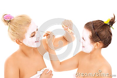 Friends applying facial masks Stock Photo