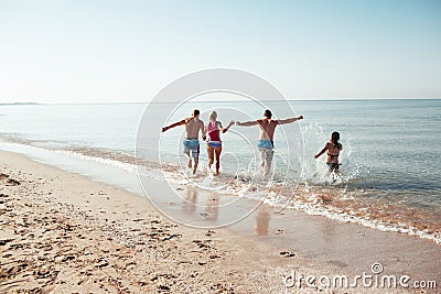 Friends on the beach. Have fun at sunny summer day Stock Photo